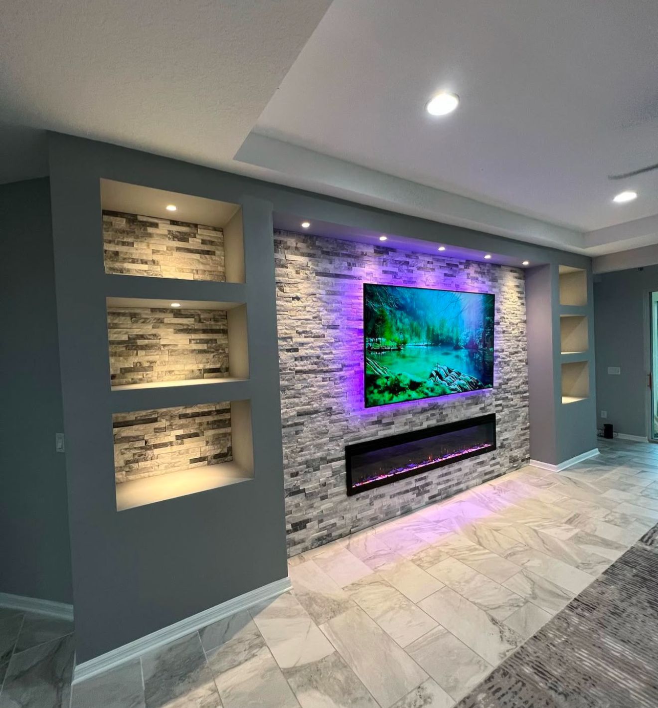 Stone Media Wall with Fireplace and Accent Lighting
